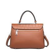 Bolsa transversal feminina em couro com textura animal print e alça removível